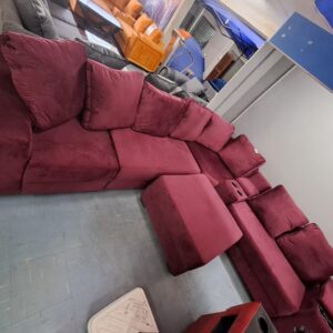 Cupholder lounge suite with pillows and ottoman